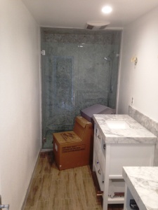 carrara shower and marble top vanity