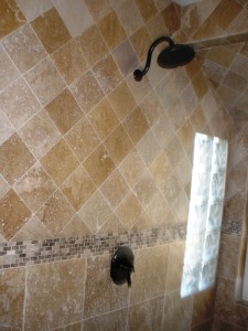 small diagonal travertine shower
