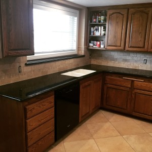 granite kitchen counter with backsplash
