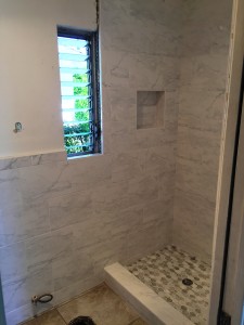 white carrara shower with marble mosaic tile