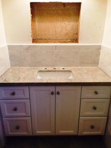 after photo of the vanity with granite counter and backsplash